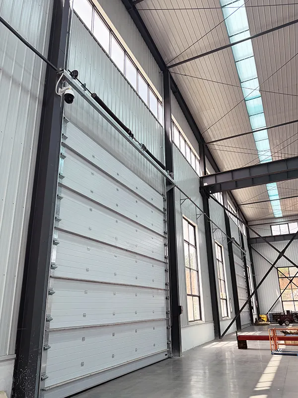 Industrial sectional door with back ribs